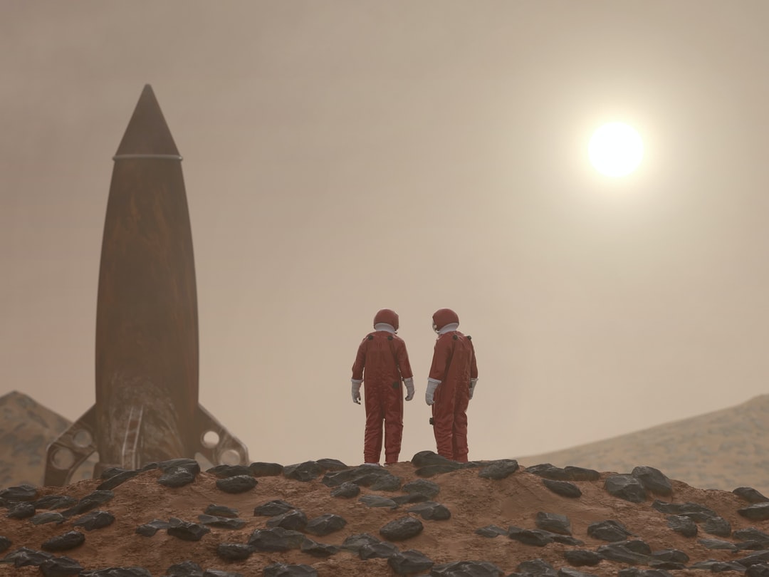 photo of two astronauts standing on Mars's surface