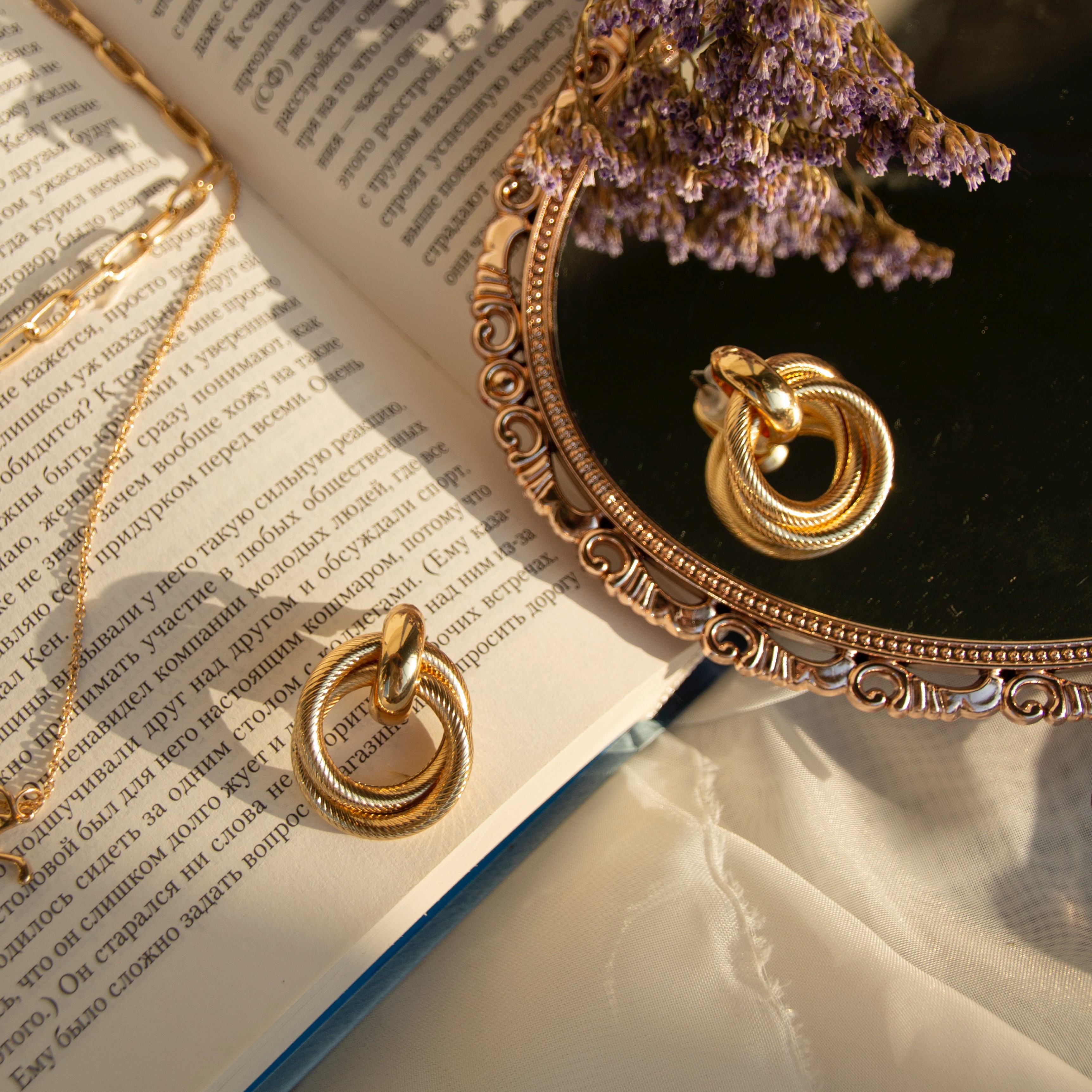Gold earrings that look like rope knots