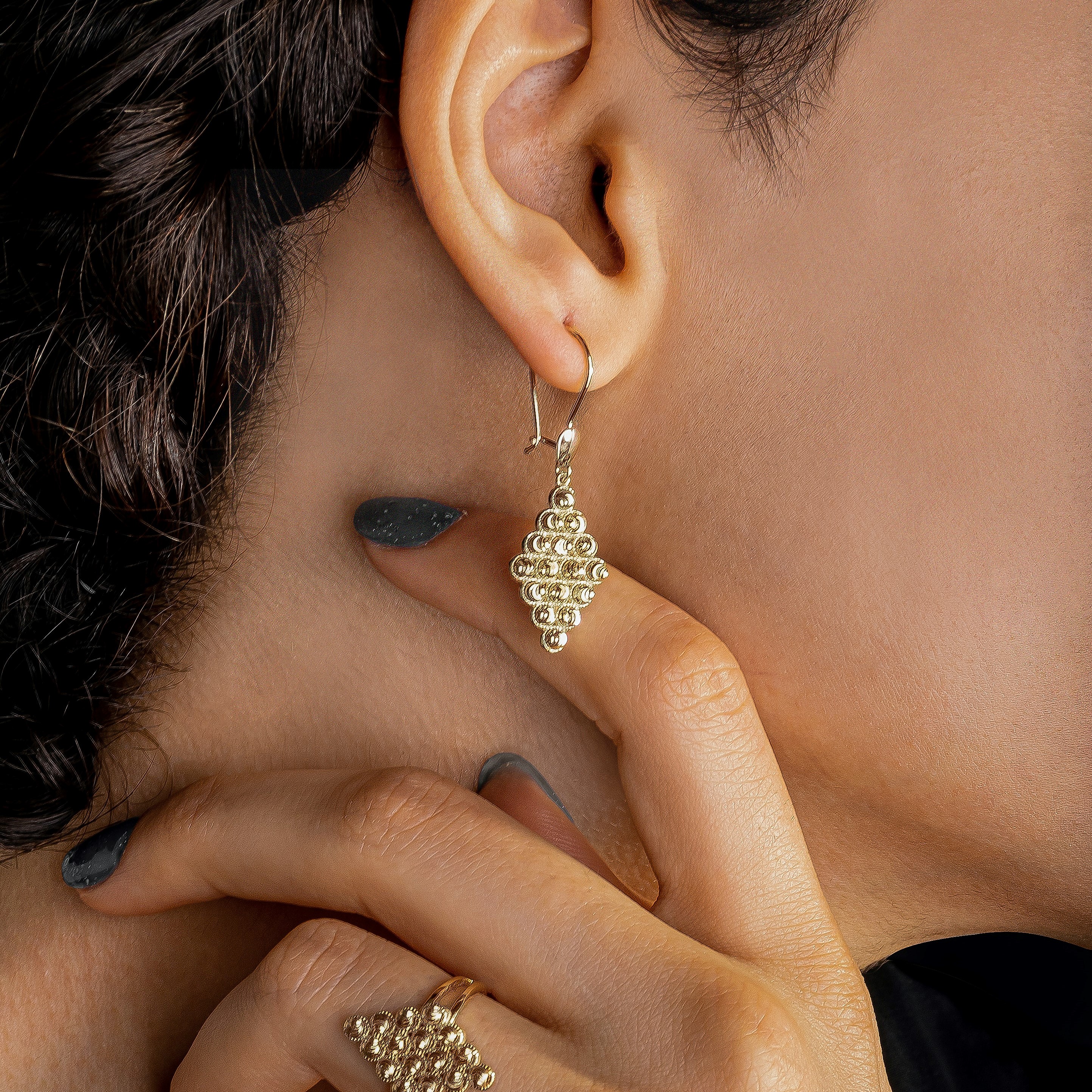 Gold diamond-shape earrings