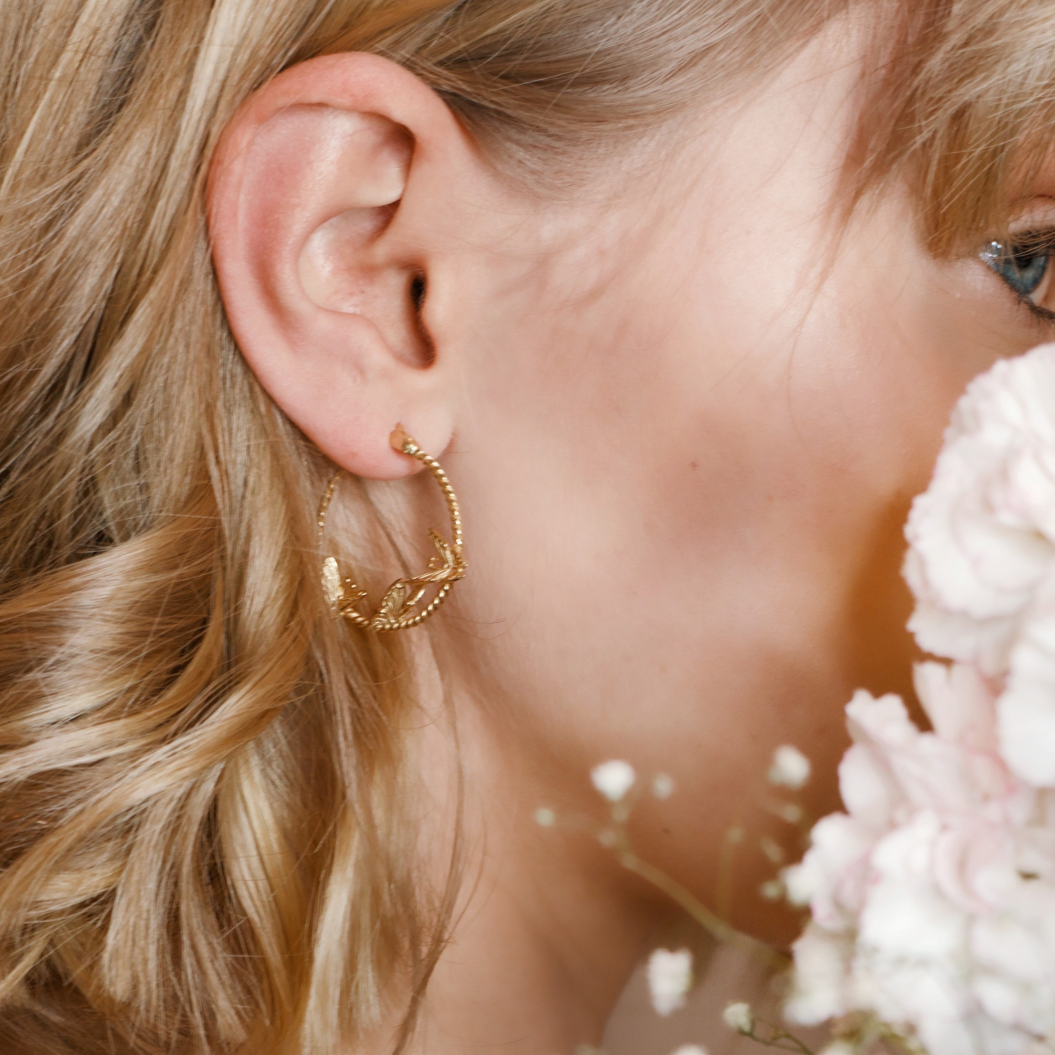Gold, round earrings with 3 little gold birds inside
