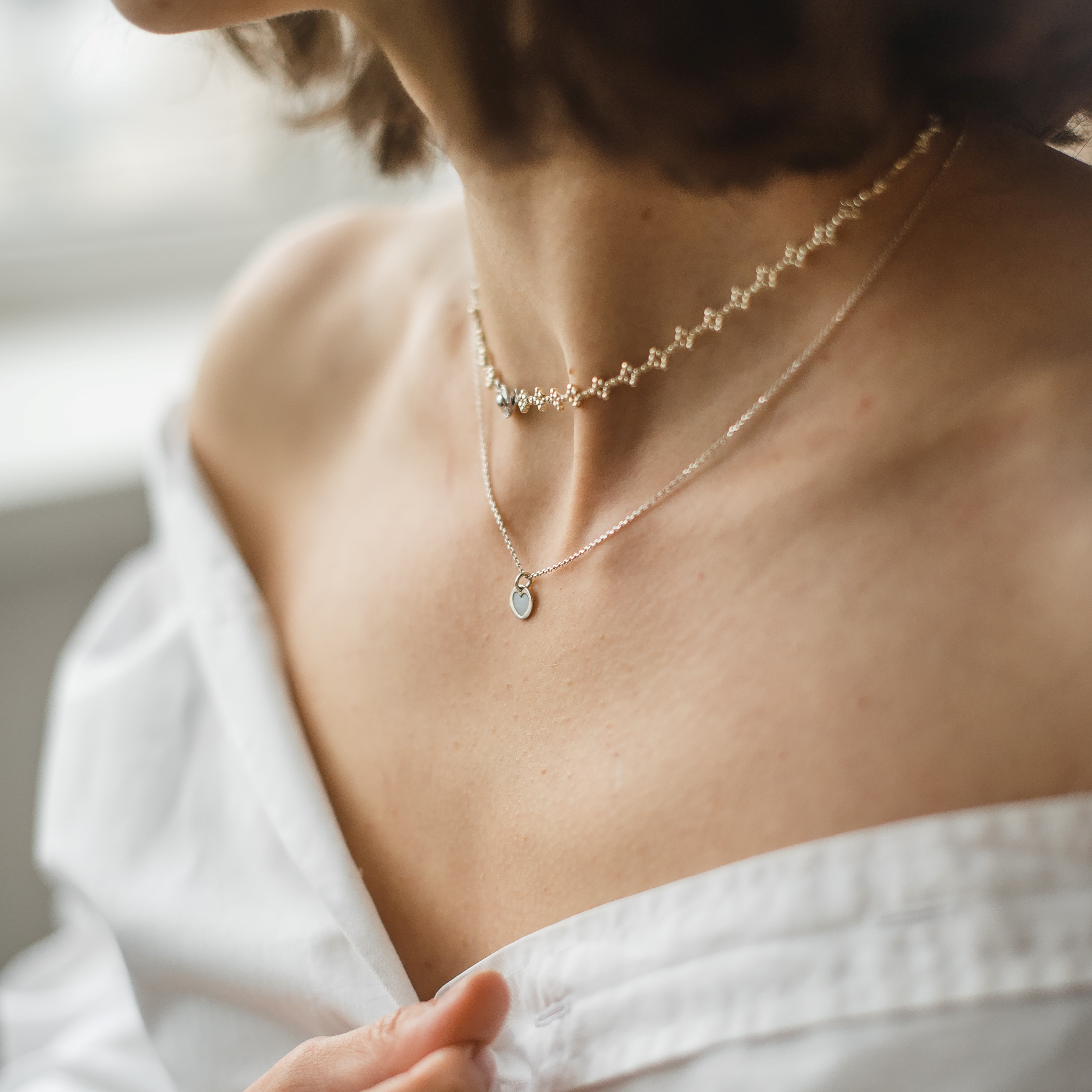 A silver thick chain with no charms