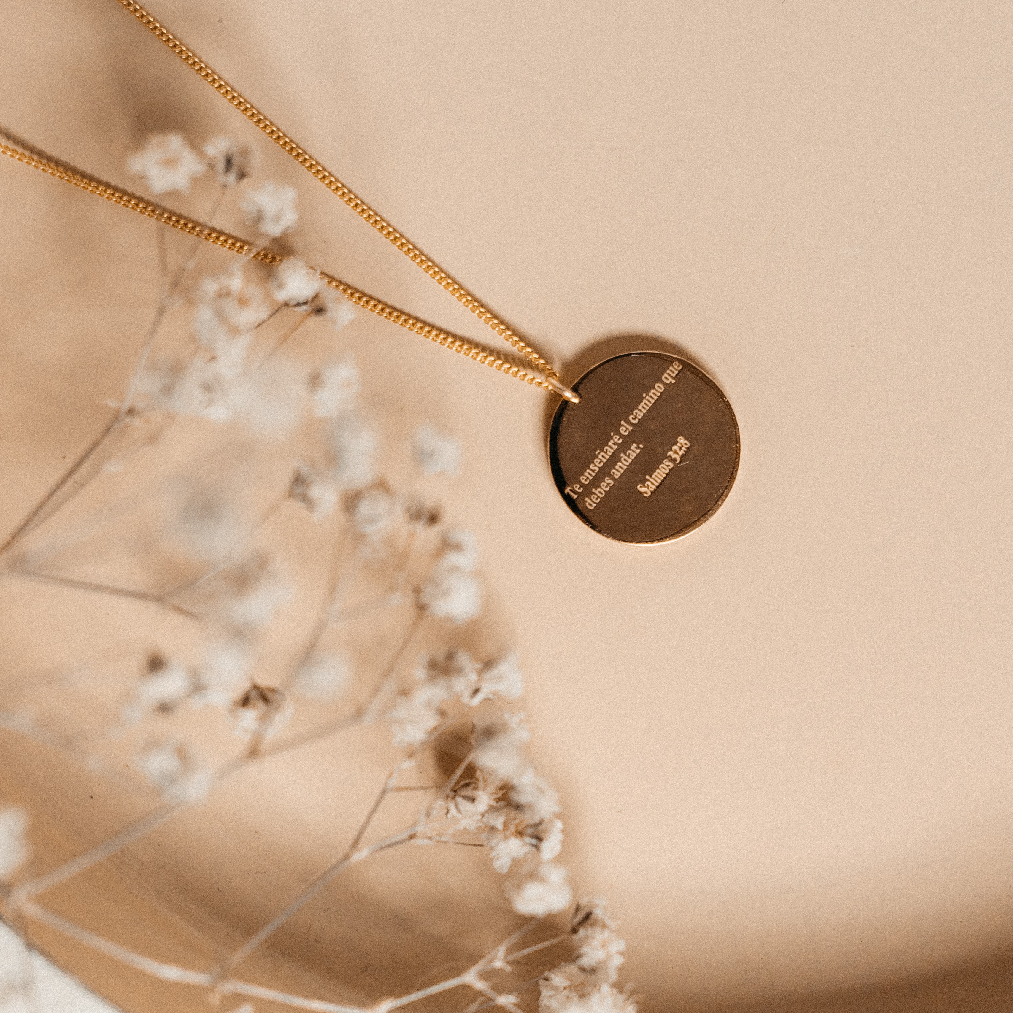 A simple round necklace with a quote