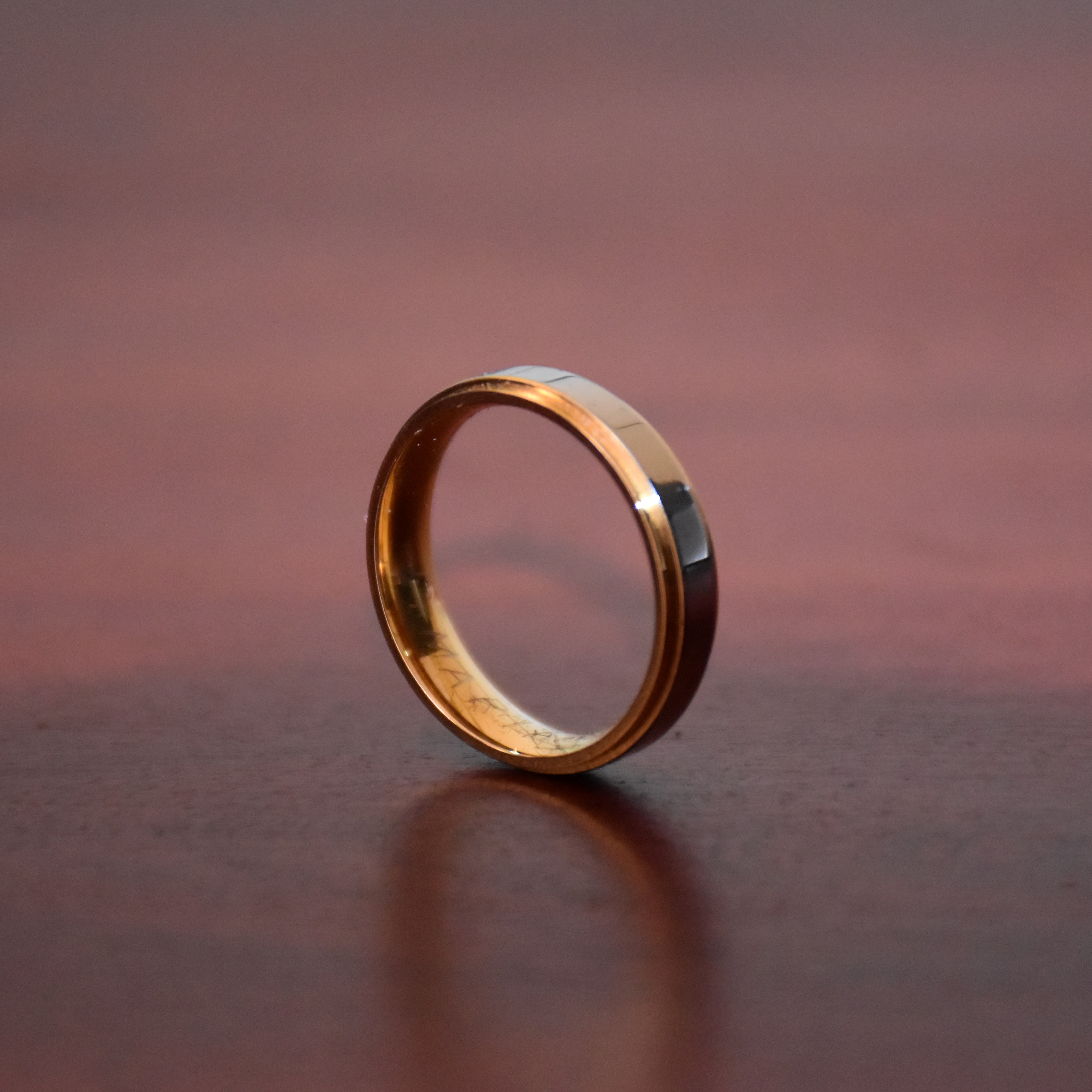 A simple gold ring with a personalized quote on the inside