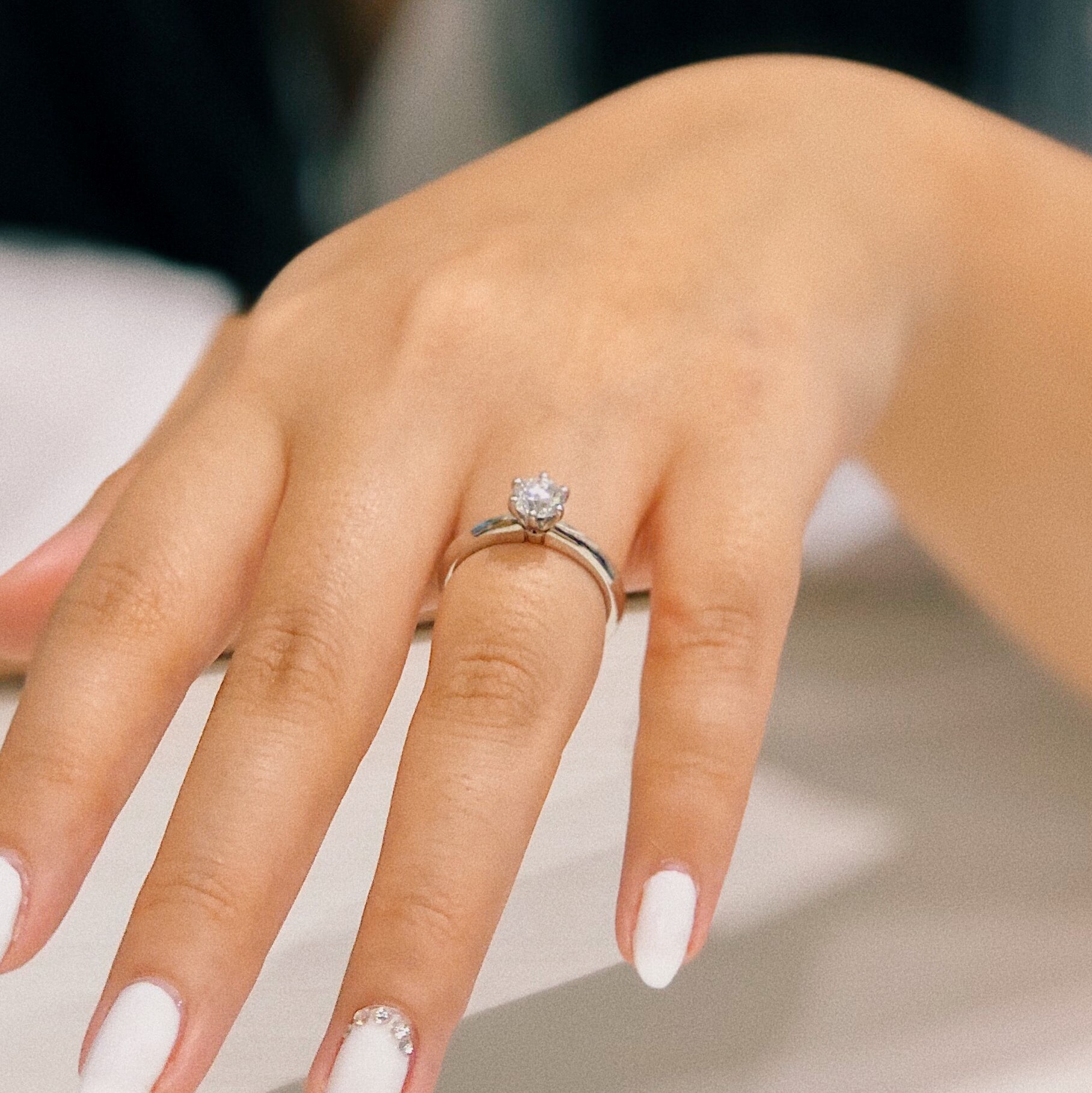 A silver ring with one big diamond