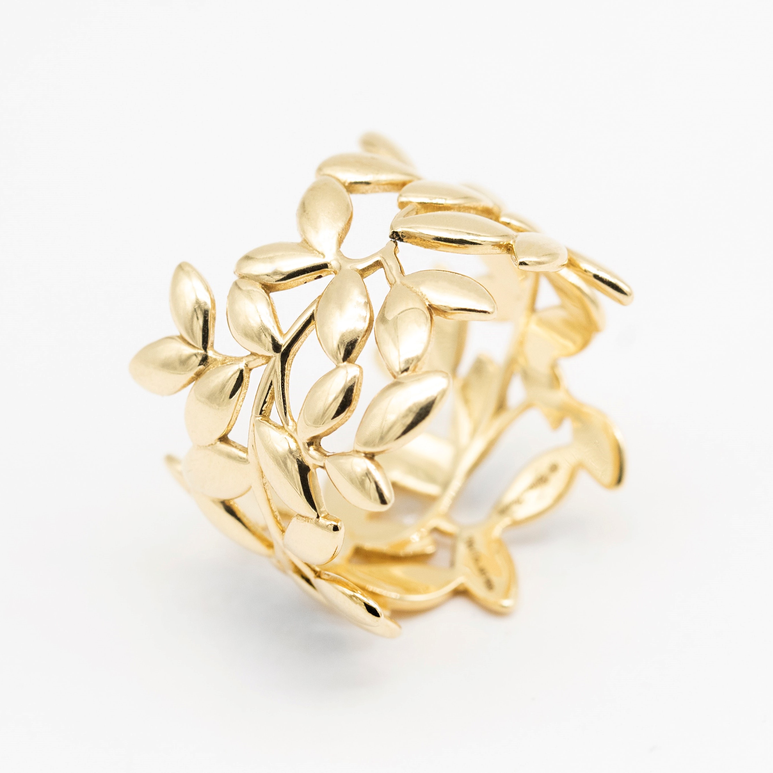A gold ring made of golden leaves