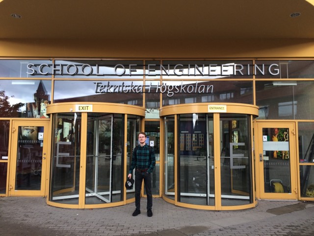 Photo of Filip in front of the JU entrance